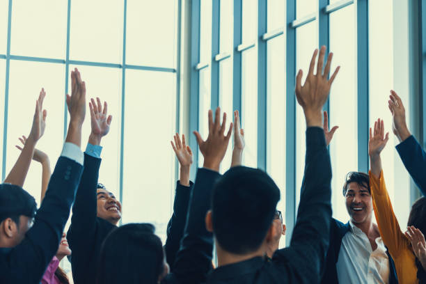 istock Successful business people raised their hands up for voting. Intellectual. 2154536430