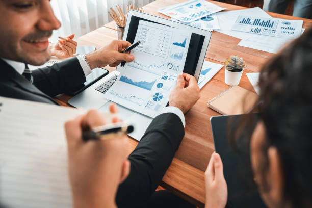istock Group of business analyst team analyzing financial data report. Habiliment 2154537980