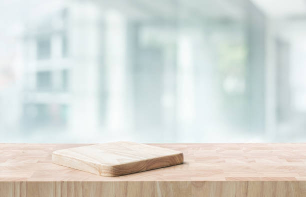istock Selective focus.End grain wood counter,table top on blur kitchen counter in morning background.For montage product display o 2154541831