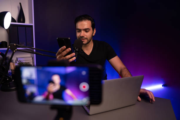 istock Broadcaster talking to listener on live streaming with blurred screen. Surmise. 2154541853