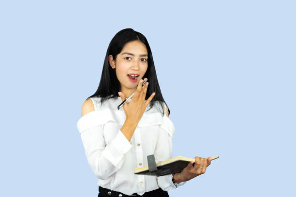 A Young Attractive Nepali Indian Girl Student with Notepad Working Giving Gestures and Expressions