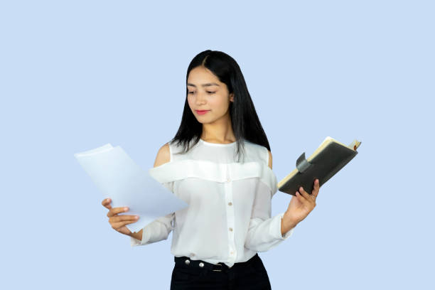istock A Young Attractive Nepali Indian Girl Student with Notepad Working Giving Gestures and Expressions 2154545763