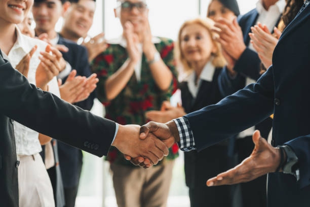 istock Cropped image of smart businessmen shaking hand, making agreement. Intellectual. 2154546045