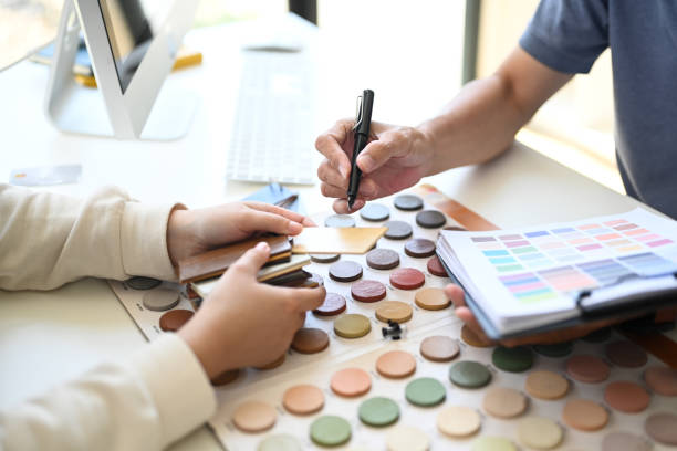 istock Cropped shot client choosing paint tone for apartment renovation with interior designer 2154546509