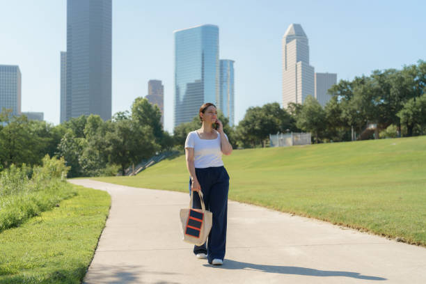 istock Woman with portable solar panel on the streets 2154547202