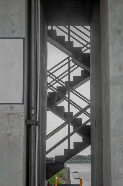 an industrial concrete staircase on the Bengawan Solo River dam building