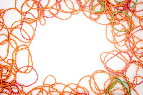 istock a collection of rubber bands that form a frame with white copy space in the middle 2154548906