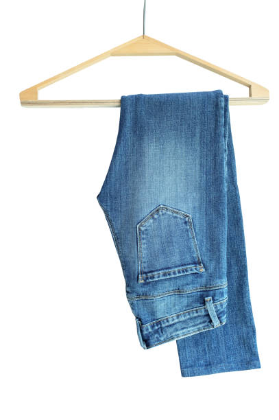 istock Jeans on a hanger isolated on white background 2154552673