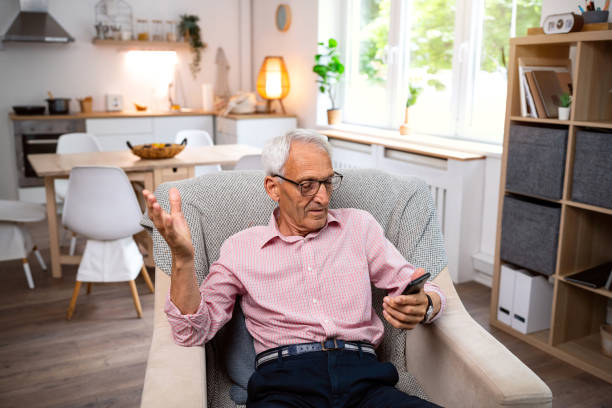 istock Confused senior man with a mobile phone 2154554854