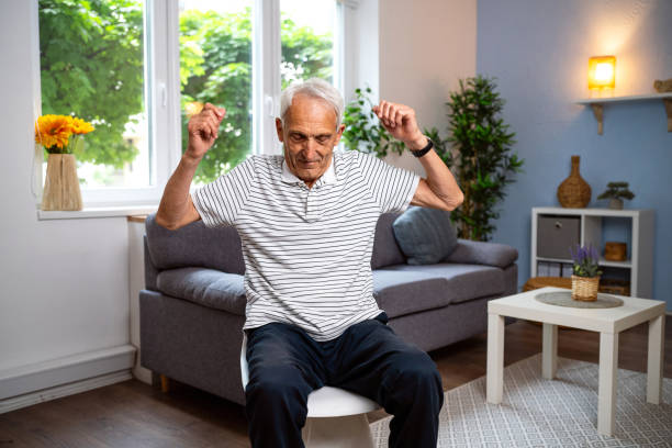 istock Senior man exercising at home 2154554991