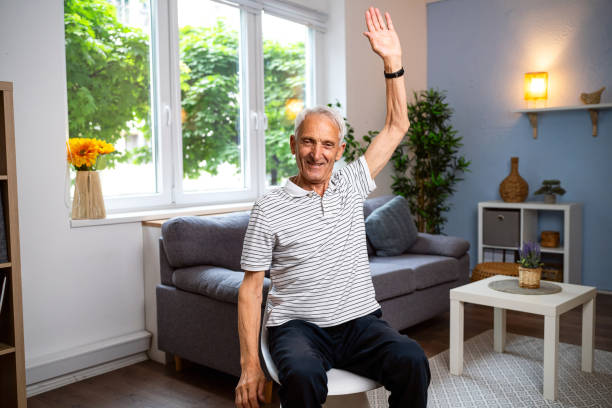 istock Senior man exercising at home 2154555030