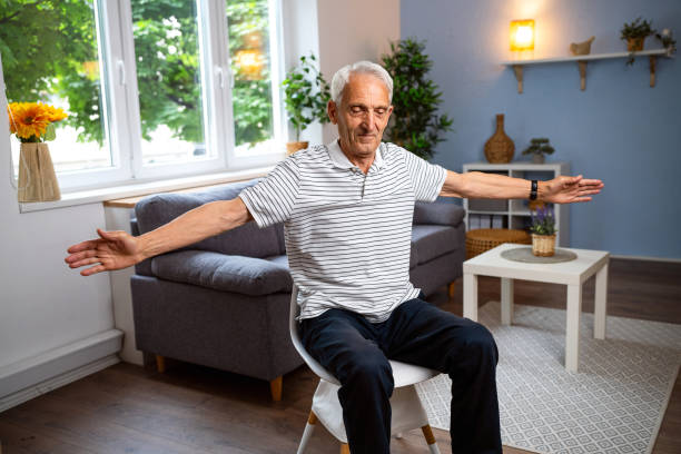 istock Senior man exercising at home 2154555033