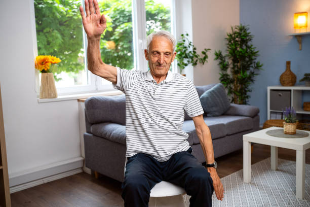istock Senior man exercising at home 2154555043