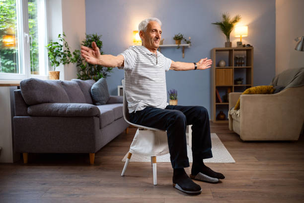 Senior man exercising at home