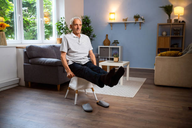 istock Senior man exercising at home 2154555084