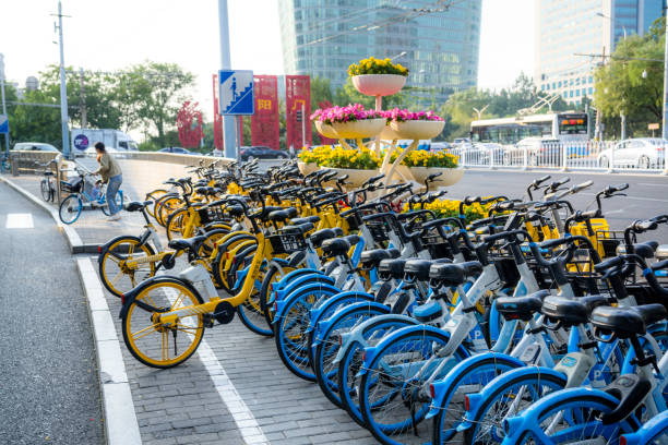 A row of colorful bicycles parked in Beijing, China on October 10th, 2023, showcasing urban bike-sharing services.