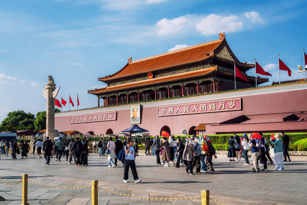 Beijing, China -- April 3, 2016. A wide angle photo of Tiananmen Square in the Forbidden City where tourists are walking around.