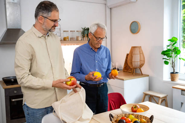 istock Adult son bought fruit for his senior father 2154555207