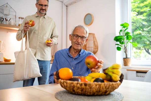 istock Adult son bought fruit for his senior father 2154555438