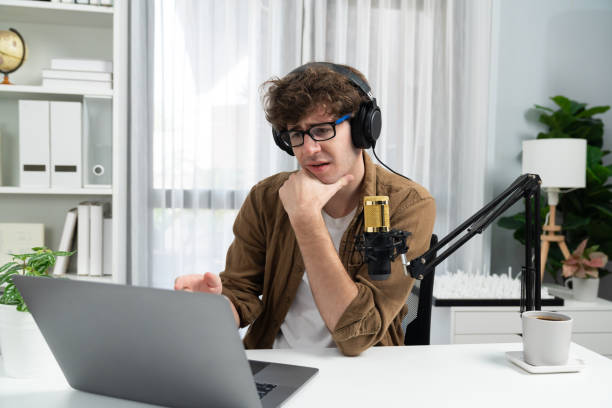 istock Influencer using headphone talking with listeners on social media. Gusher. 2154555494