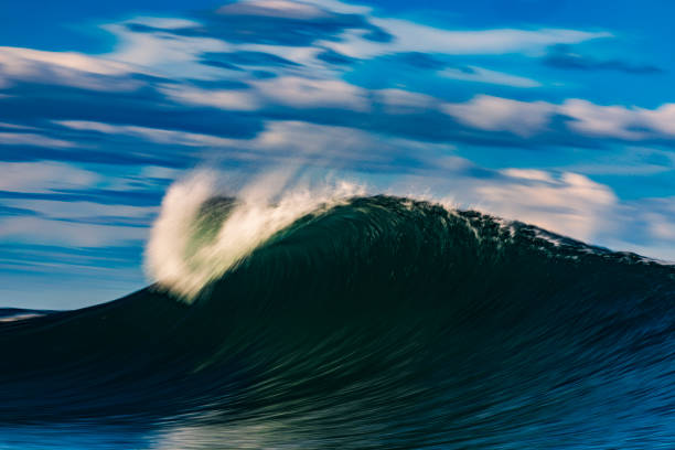 istock Abstract offshore wave breaking in warm afternoon light captured with blurred motion 2154556681