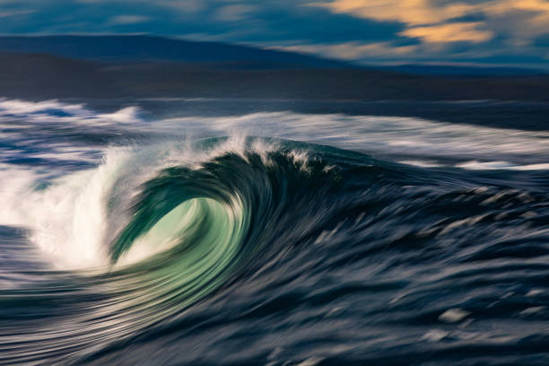 istock Abstract offshore wave breaking in warm afternoon light captured with blurred motion 2154556707
