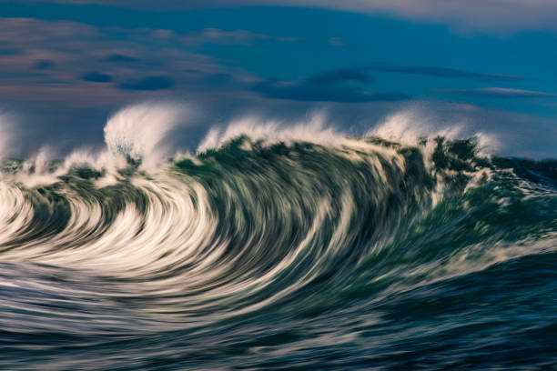 istock Abstract offshore wave breaking in warm afternoon light captured with blurred motion 2154556714