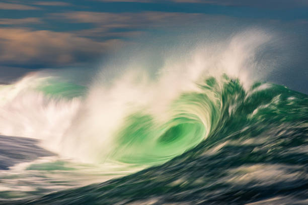 Abstract offshore wave breaking in warm afternoon light off the coast of Southern NSW, Australia.