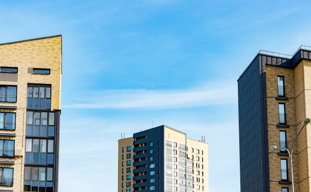 istock Modern apartment building with blue sky, luxury balconies, and contemporary architecture. Investment 2154557024