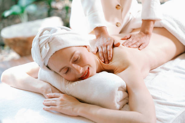 istock Beautiful young woman received a back massage on a spa bed. Tranquility. 2154558420