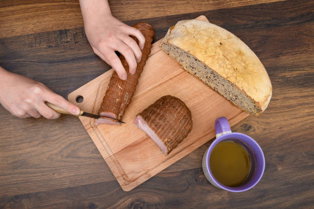 istock Cold meat and wheat bread on a cutting board prepared for breakfast 2154558491