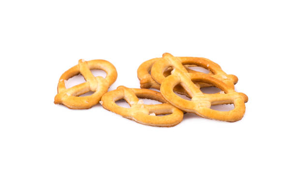 istock Delicious crispy pretzel crackers isolated on white, top view 2154558653
