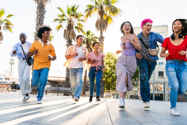 istock Multiethnic group of young happy friends hanging out 2154561002