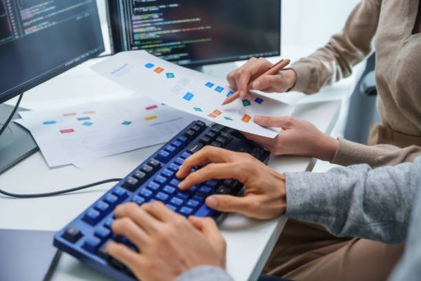 asian and Indian Developer team discussion feedback analysis coding data with software computer at office asian and Indian Developer team discussion feedback analysis coding data with software computer at office medical device software development stock pictures, royalty-free photos & images