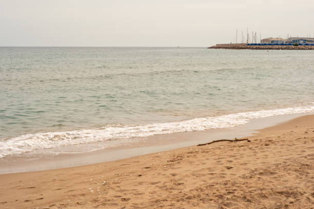 istock Sea wave and sand on the beach 2154561798