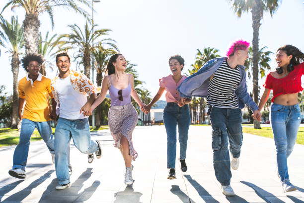 istock Multiethnic group of young happy friends hanging out 2154563607