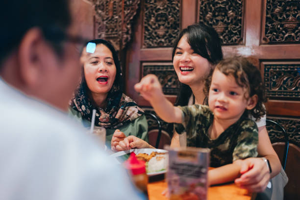 istock multiracial three generations family having dinner together outdoors in the restaurant 2154563867