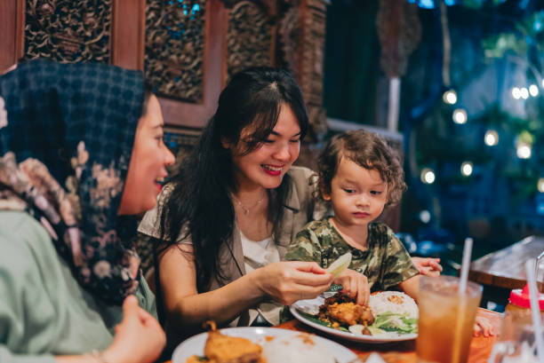 istock multiracial three generations family having dinner together outdoors in the restaurant 2154563883