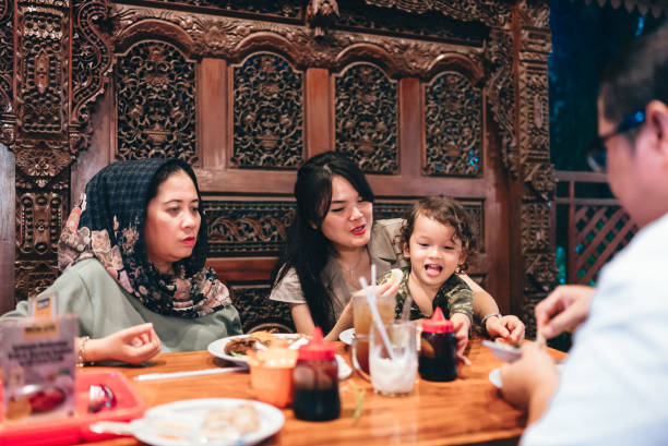 istock multiracial three generations family having dinner together outdoors in the restaurant 2154563893