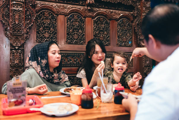 istock multiracial three generations family having dinner together outdoors in the restaurant 2154563895