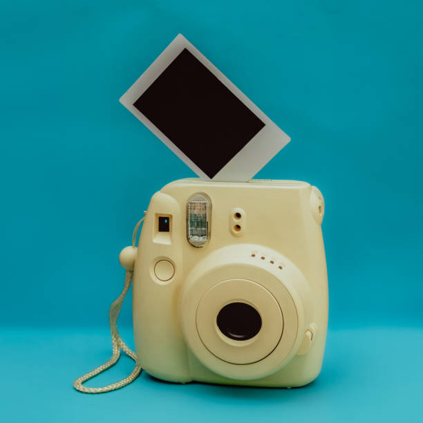 istock Vintage yellow camera with pictures for collages 2154563992