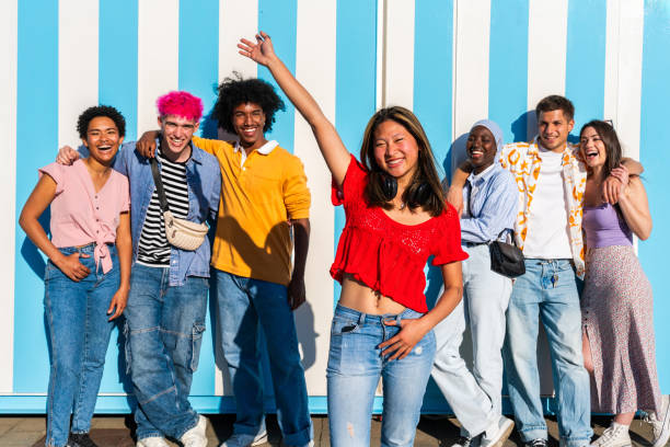 istock Multiethnic group of young happy friends hanging out 2154564253