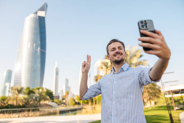 istock Young male tourist taking selfies while visiting Kuwait 2154568481