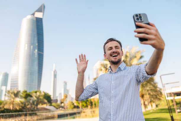 istock Young male tourist taking selfies while visiting Kuwait 2154568484