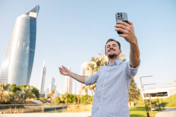 istock Young male tourist taking selfies while visiting Kuwait 2154568490