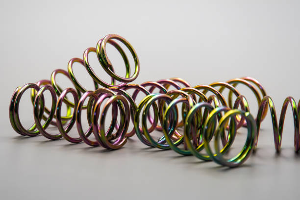 istock steel compression coil springs with varied surface finish isolated on grey background 2154568736
