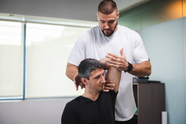 istock Young man getting stretched by a professional masseur 2154569448