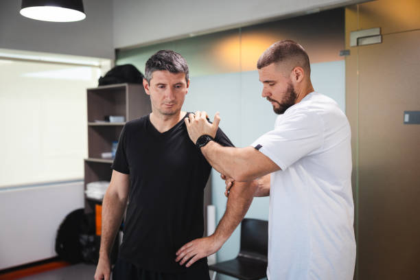 istock Young man getting stretched by a professional masseur 2154569472