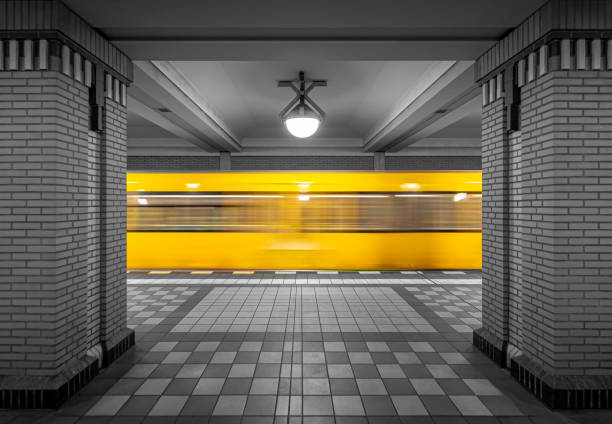 yellow subway goes into the station