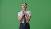 Pilot Praying On Ramp Asian Woman Pilot Praying For Something While Standing In The Green ...